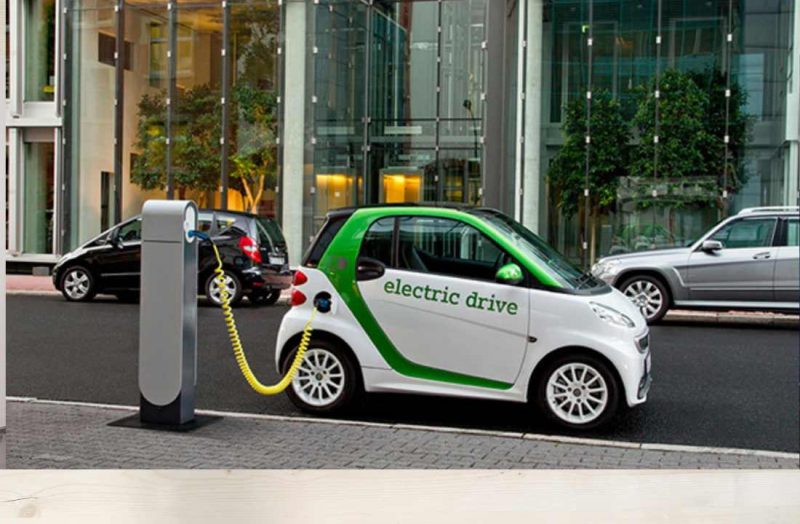 A small electric car on charging