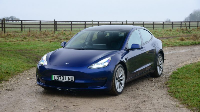 Blue Tesla Model 3 standing
