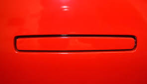 red Tesla door handle
