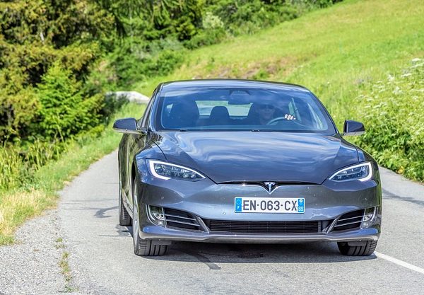 a tesla model on the road